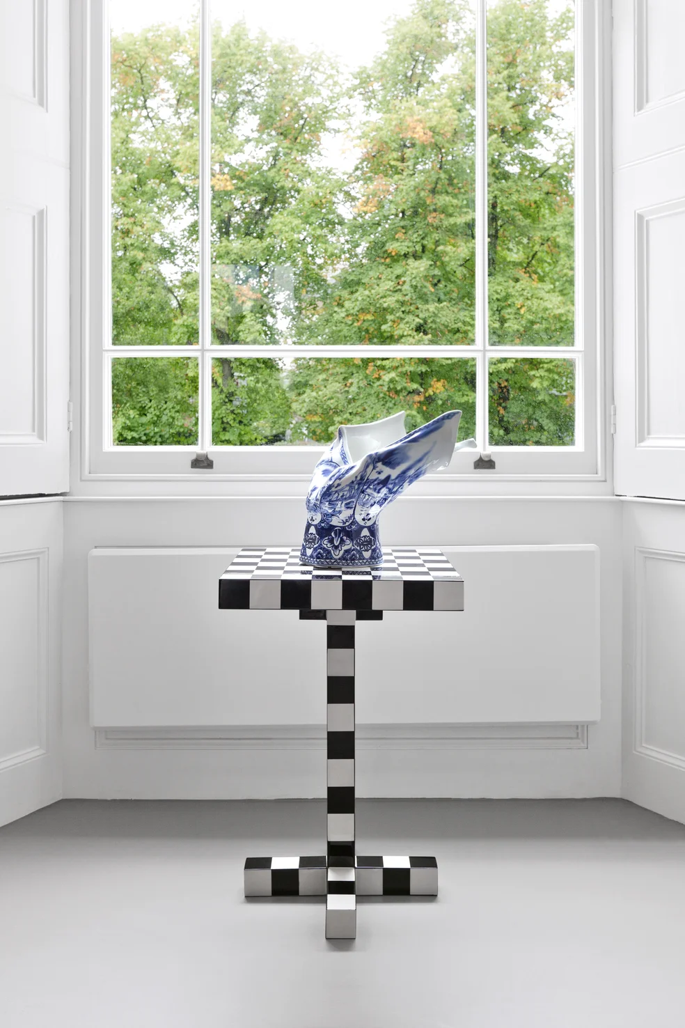 Blow away vase on a chest table 